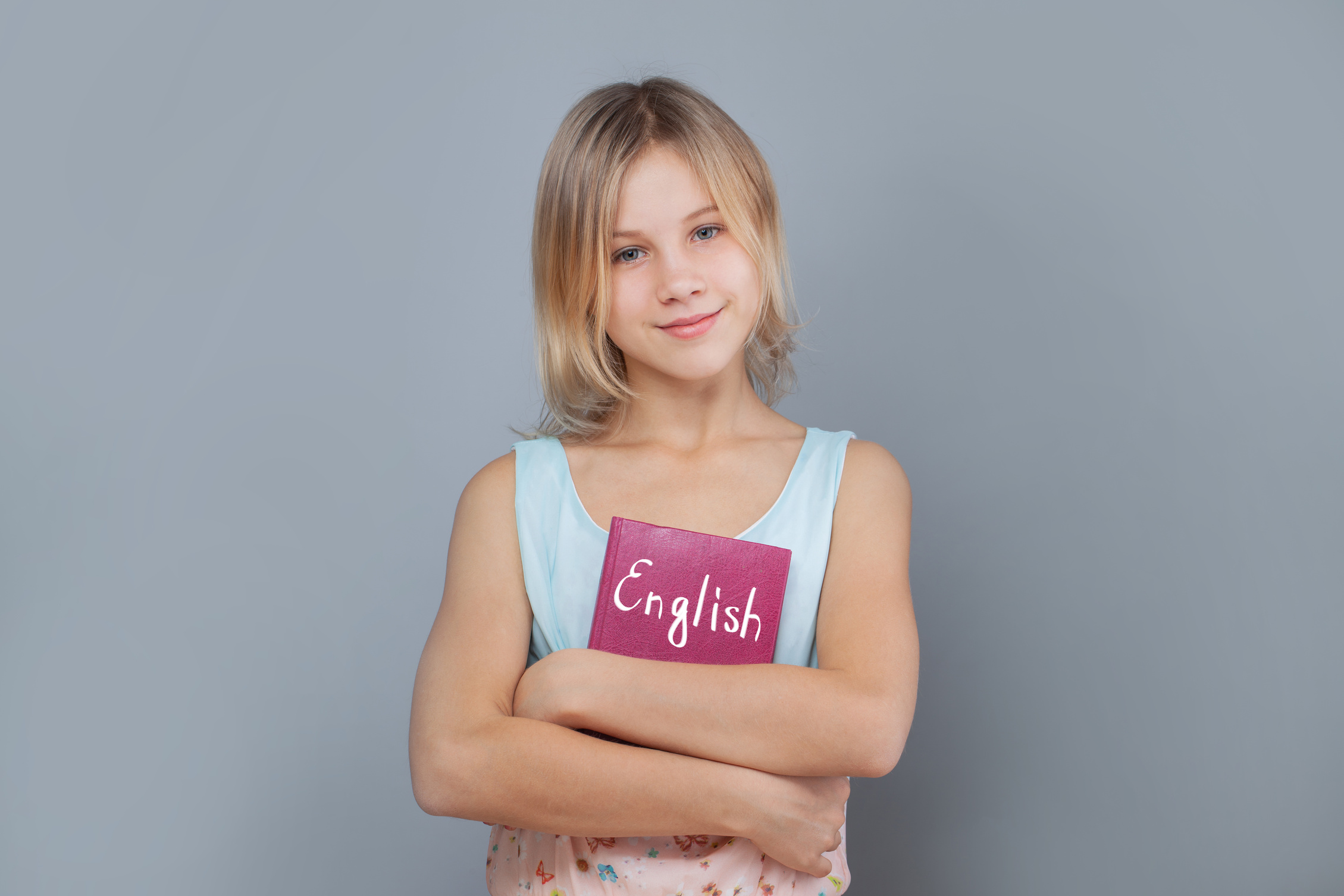 Cute girl with english book. Learn english concept.